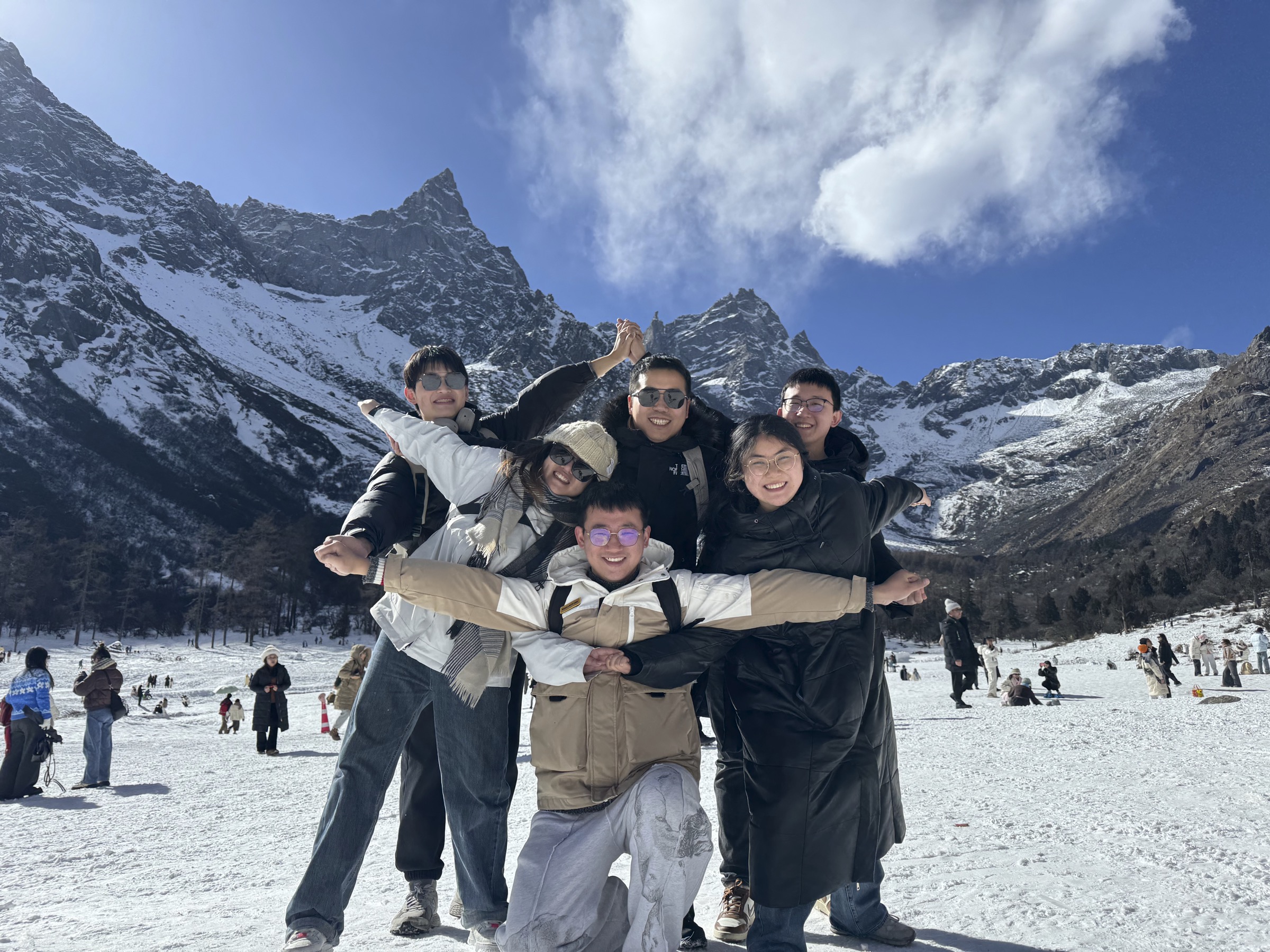 Taoran Group members in front of snowy mountains