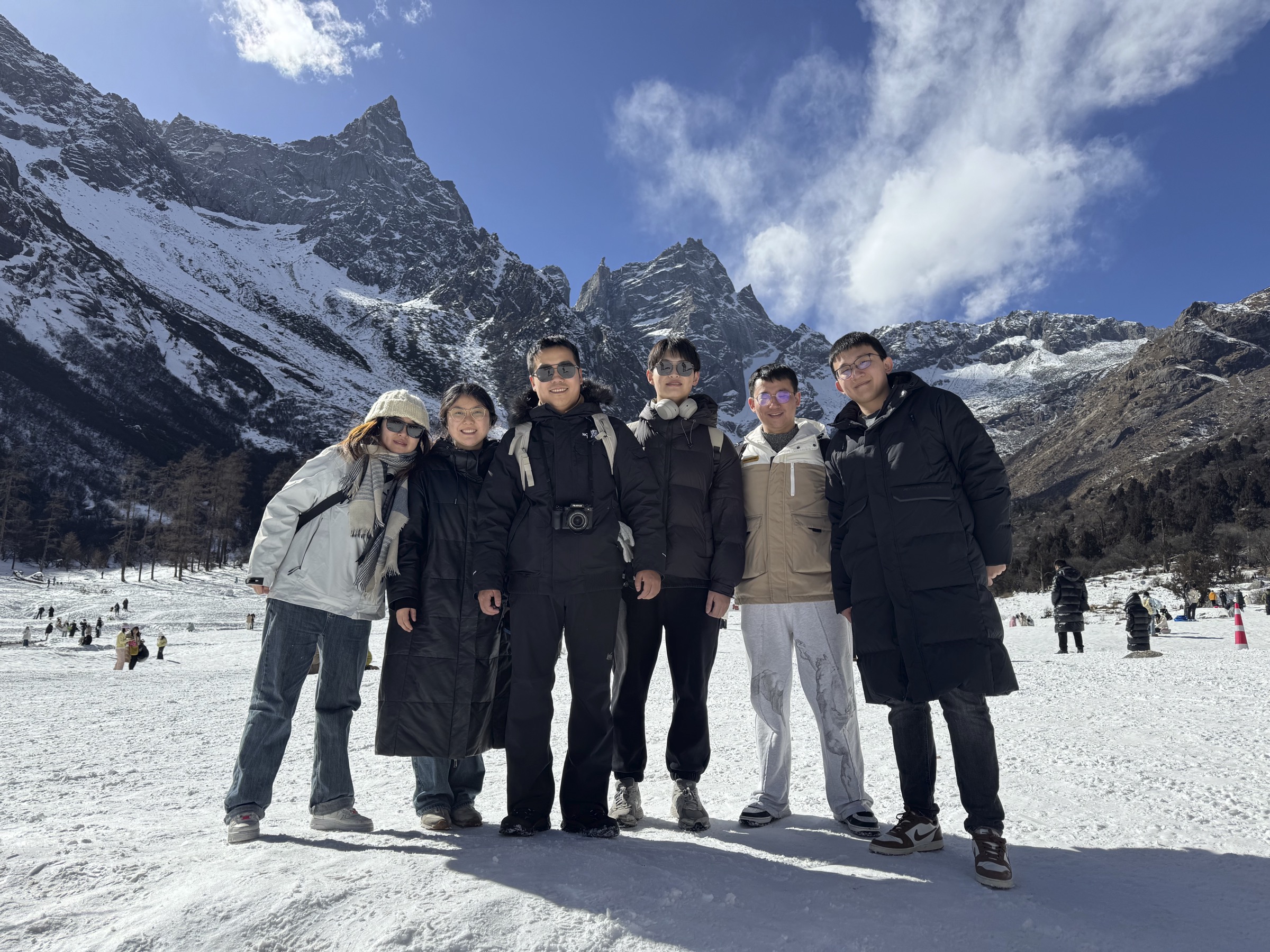 Taoran Group members in a snowy mountain landscape