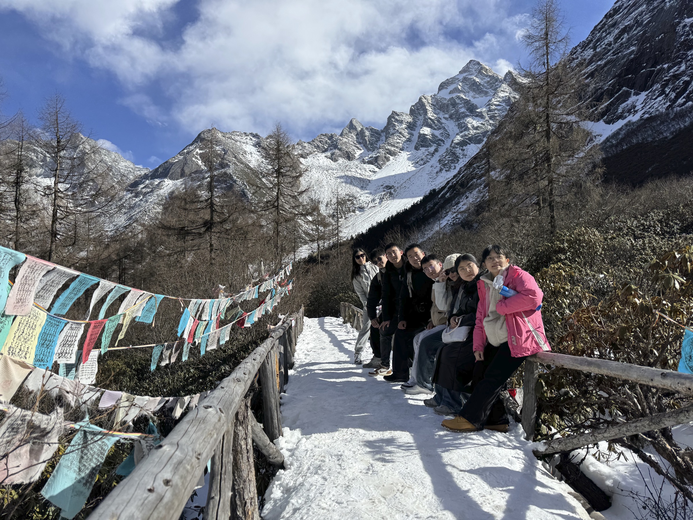 Taoran Group members on a snowy mountain trail